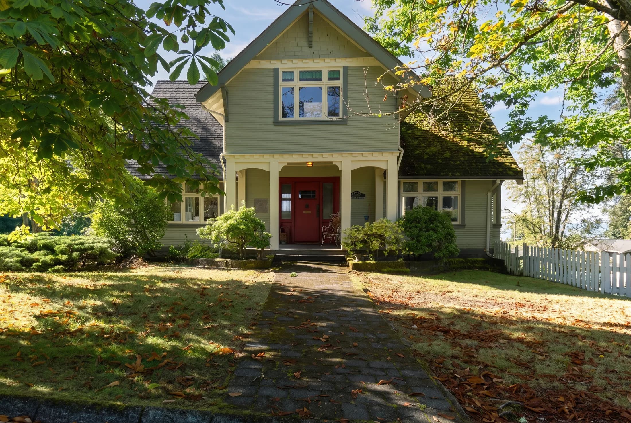 Vancouver heritage home with heavy roof moss before treatment