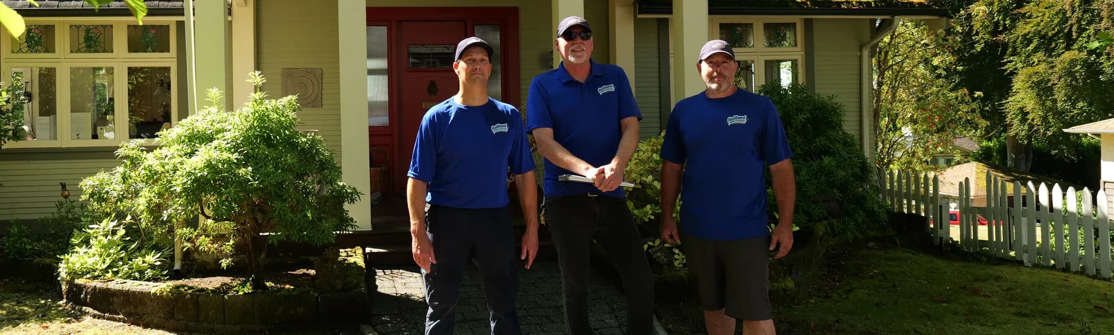 The Holland Home Services crew outside a Vancouver heritage home