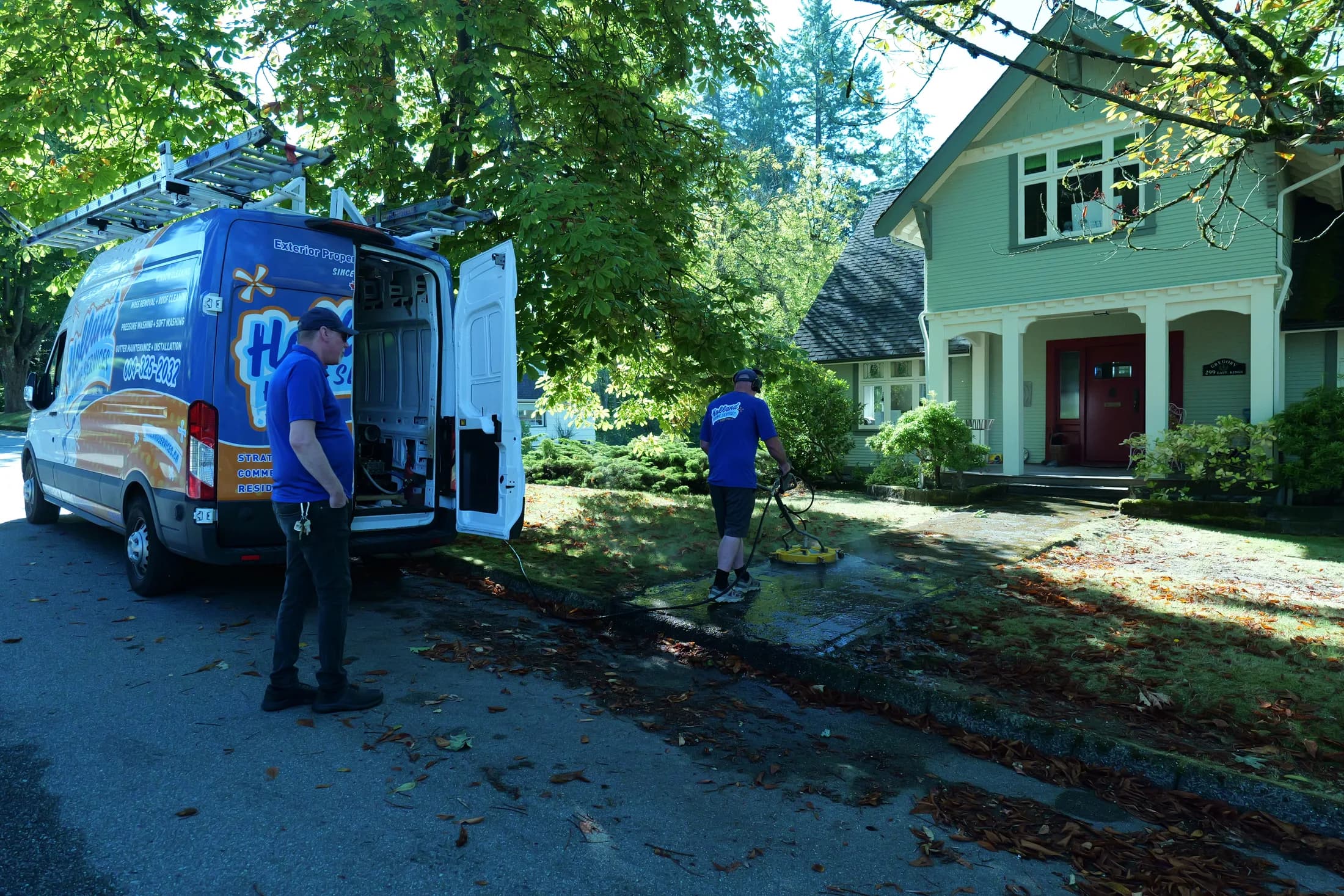 Holland Home Services branded van outside a Greater Vancouver home
